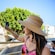 A Guest takes a picture on a mobile phone during a bus tour in Málaga, Spain